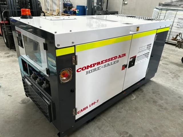 190CFM skid mounted compressor side angle showing outlet connections